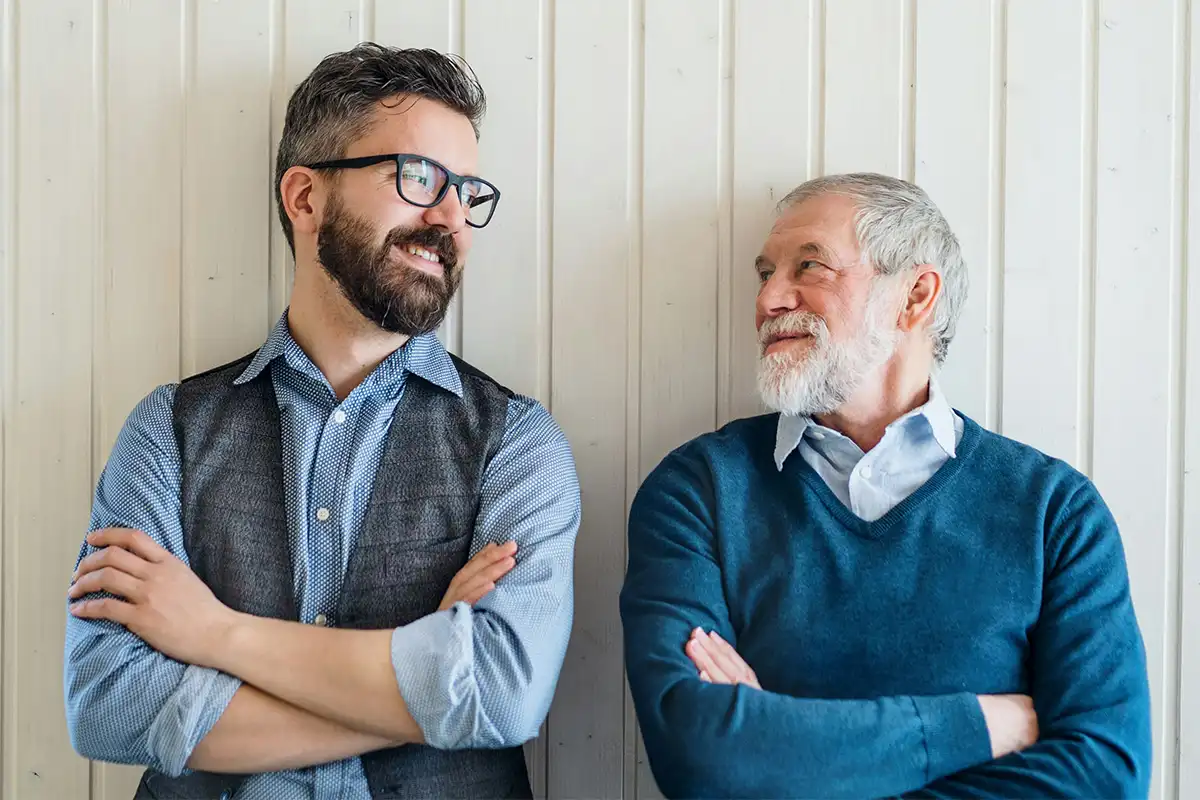 Two men with glasses stand side by side, embodying the importance of setting boundaries for personal peace