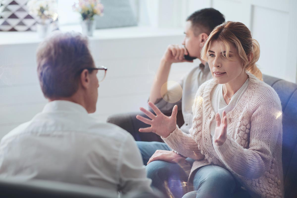 a wife explains what she feels and what's going on inside her mind to a psychiatrist with the husband beside her