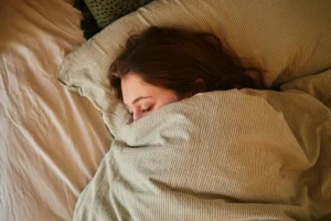 a woman with depression lying on the bed in southern california