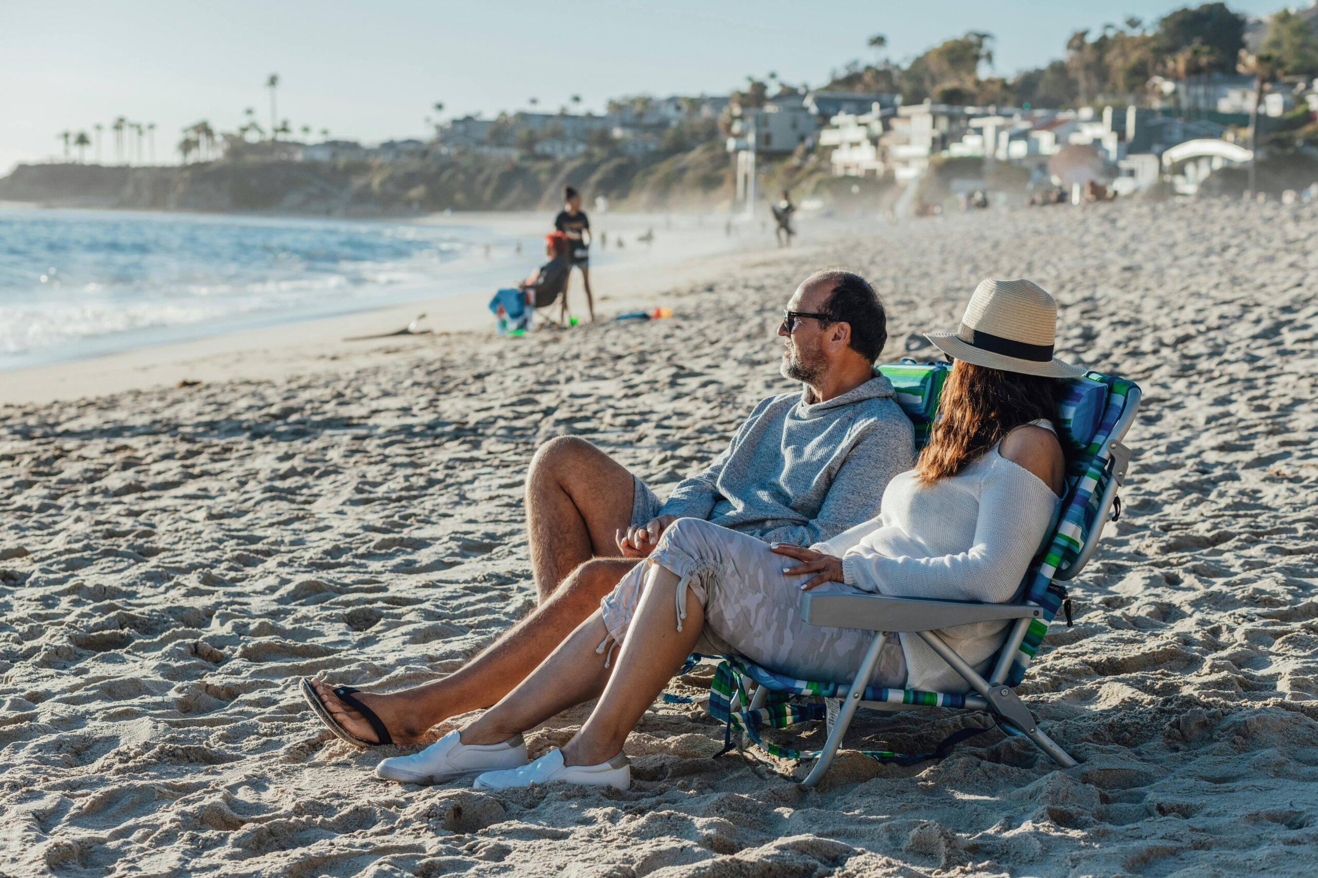 Couple sitting on newport beach motivational interviewing for trauma