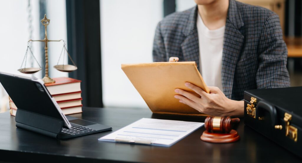 A legal professional reviewing documents in an office