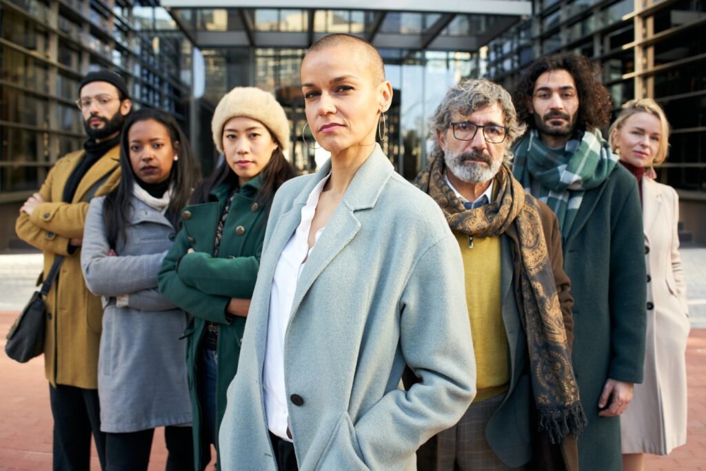 A diverse group of adults standing together