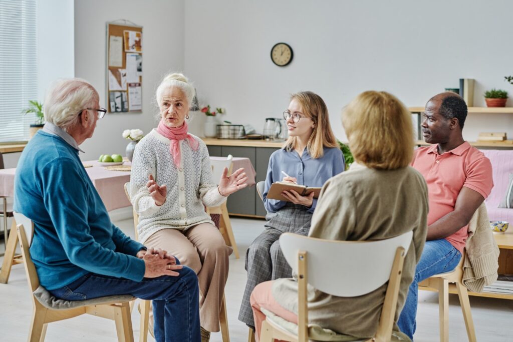 Group therapy session in bright modern home settin