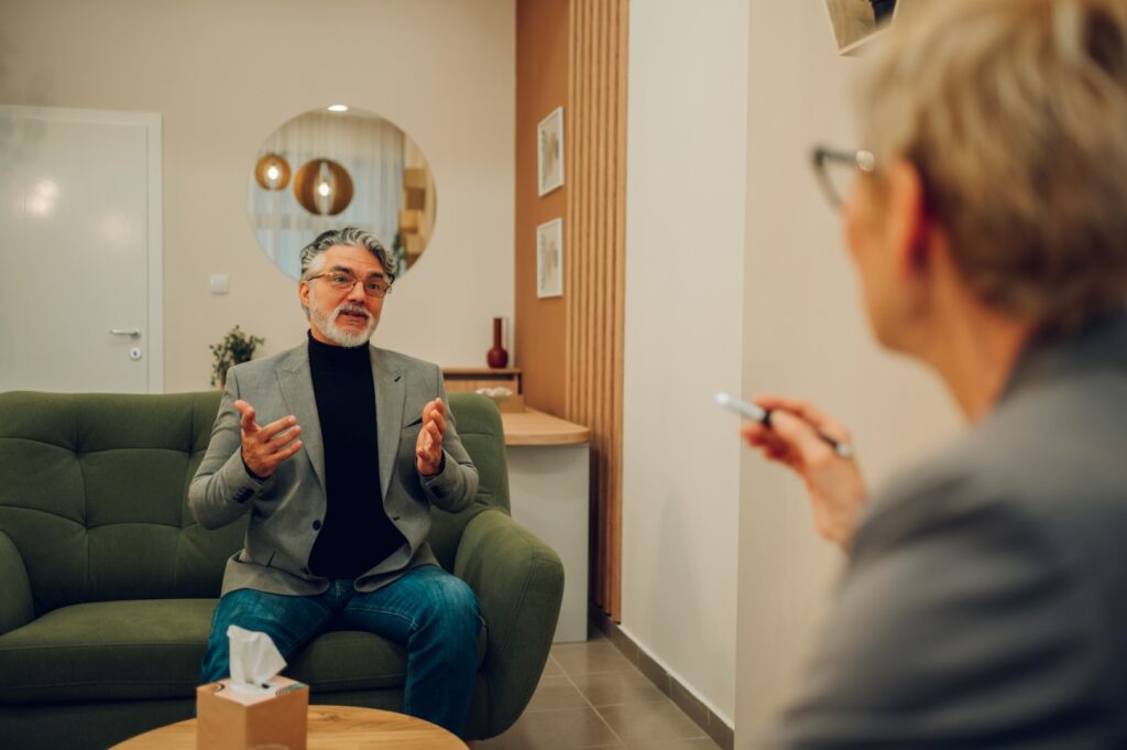 Man talking with therapist in office