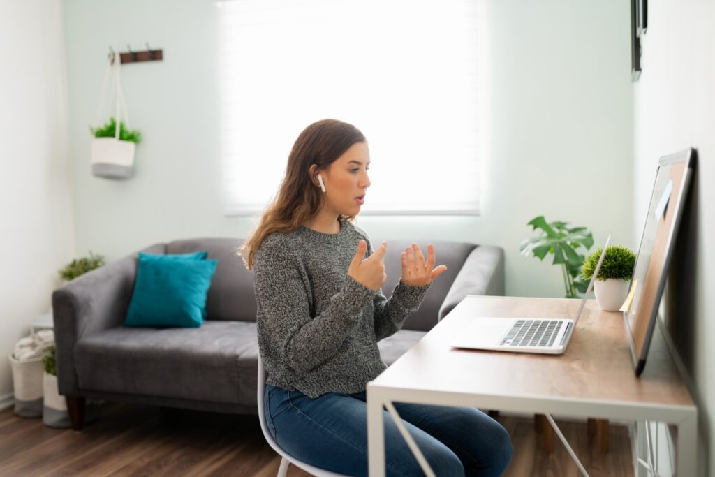 Woman on video call indoors at home desk