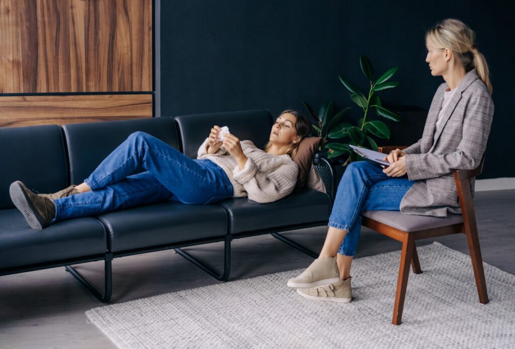 Woman talking with therapist in office interior