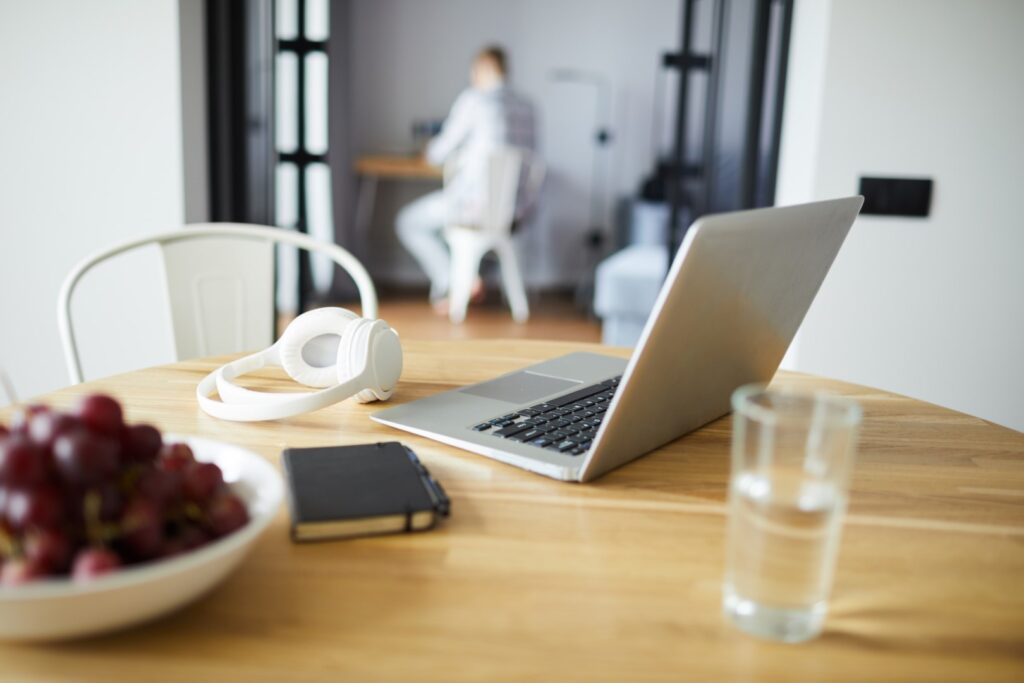 Work from home setup with laptop and fruit